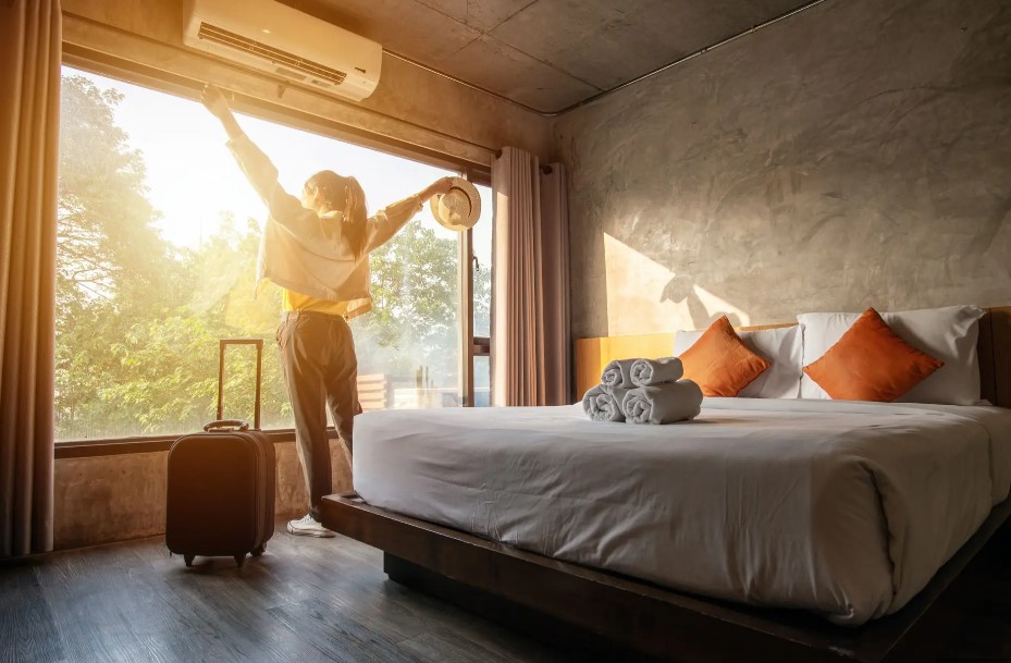 happy traveler checking into a hotel